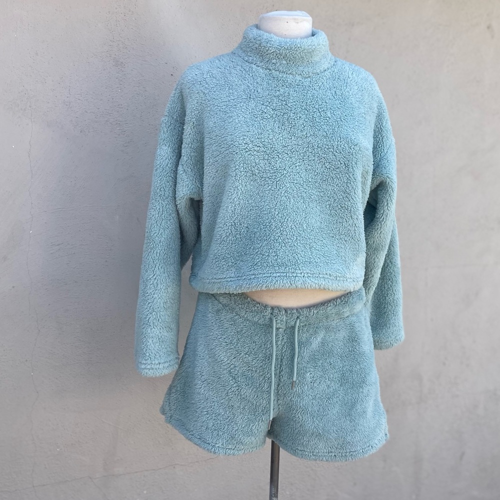 Matching Light blue faux shearling shorts and top.
